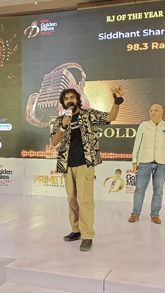 Siddhant Sharma receiving the RJ of the Year Golden Mikes award in 2025